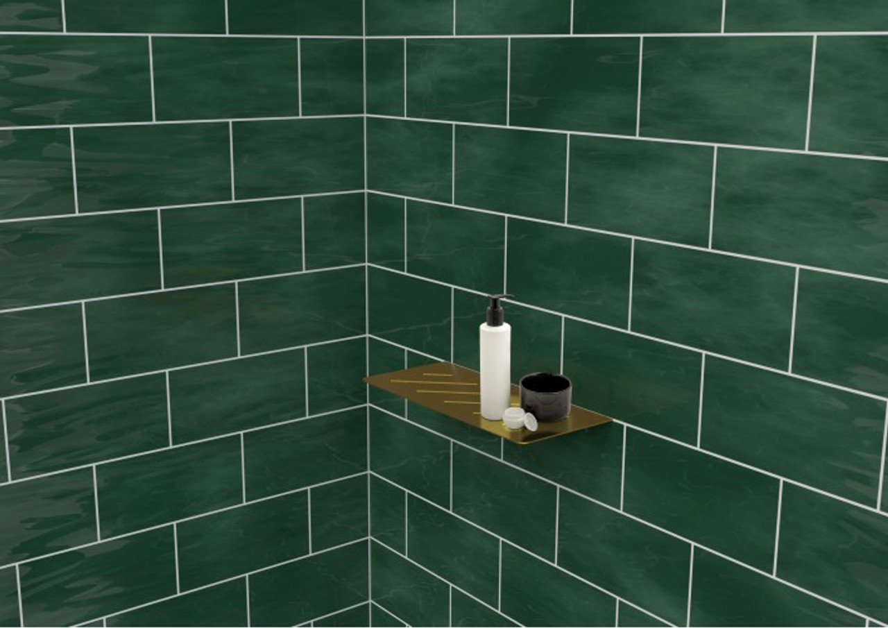 Genesis Stainless Steel Tile In Shower Shelf installed in a shower with green tiles