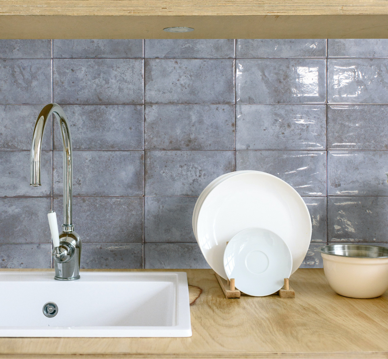 Denim blue distressed glossy metro tiles used on the wall in a kitchen