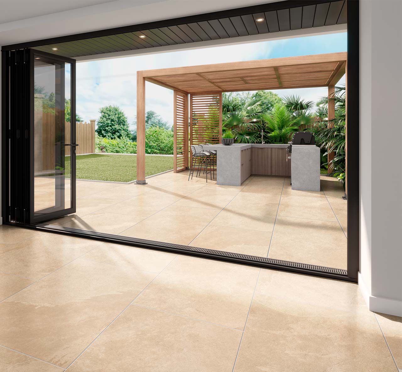 Fossil khaki stone effect porcelain paving tiles used on a patio with matching indoor floor tiles