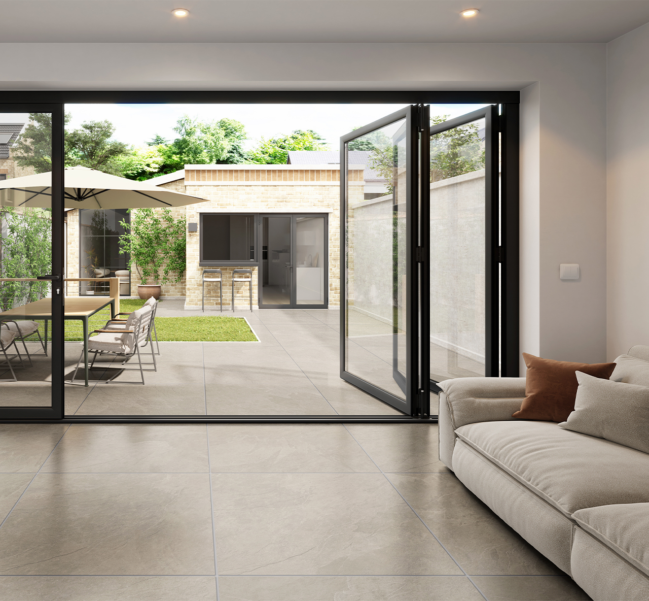 Valverdi Fossil Ash beige stone effect outdoor porcelain tiles used outdoors on a patio with matching indoor tiles