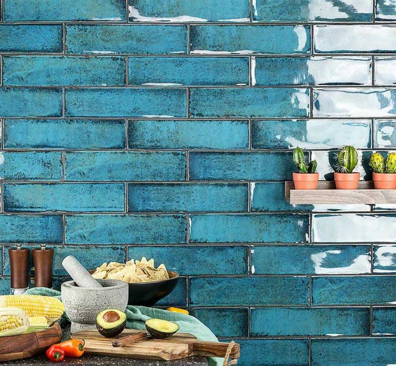 Bright blue glossy metro tiles on a kitchen wall in a brick bond pattern