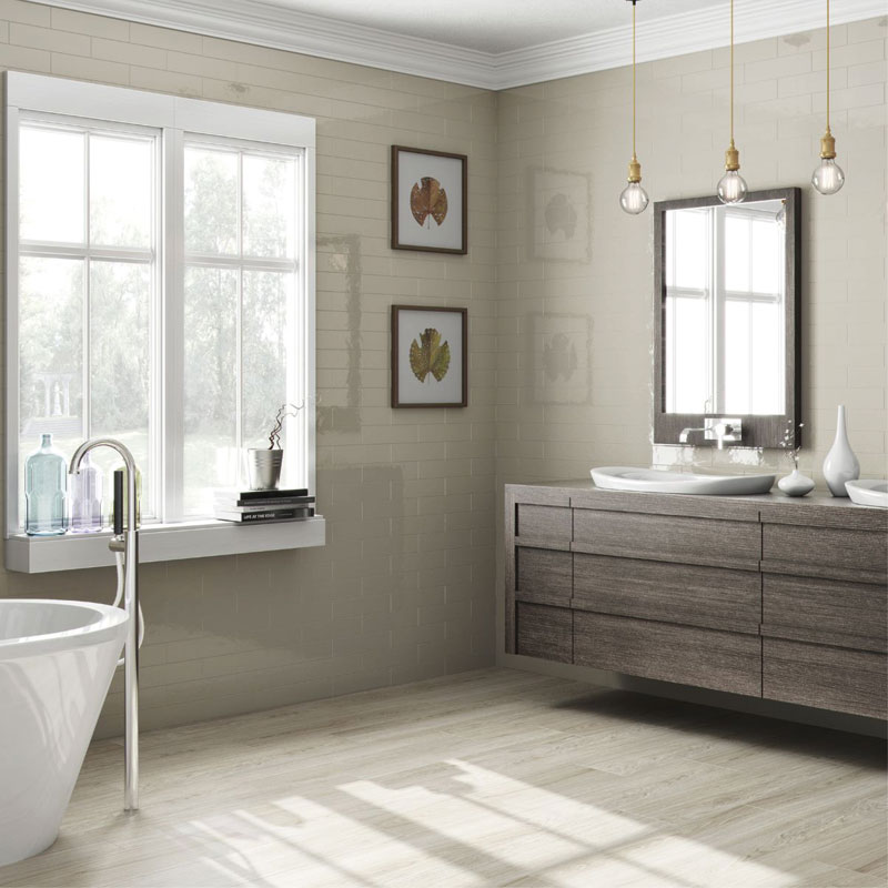 Bronte Ivory Metro Wall Tiles used as bathroom wall tiles in a modern spacious bathroom with natural light