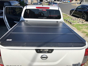 INTRODUCING THE QUAD-FOLD TONNEAU COVERS