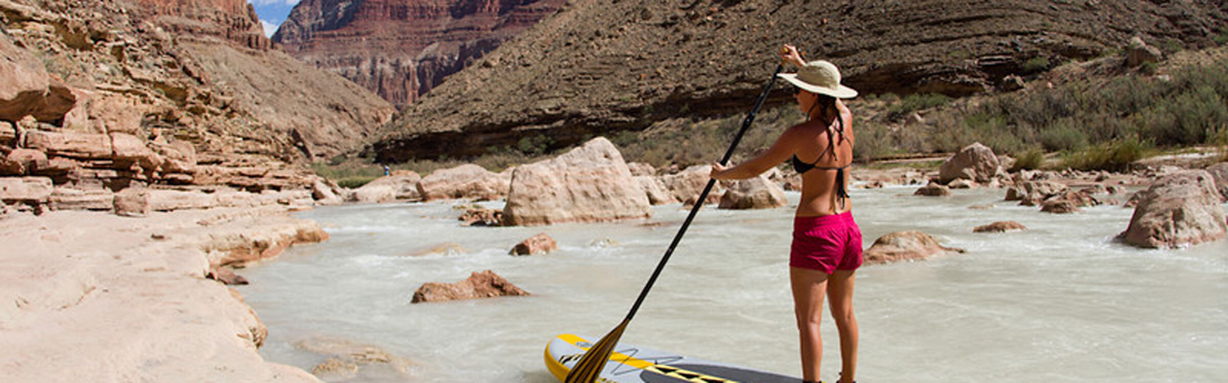Alison Teal paddleboarding and exploring remote waterways
