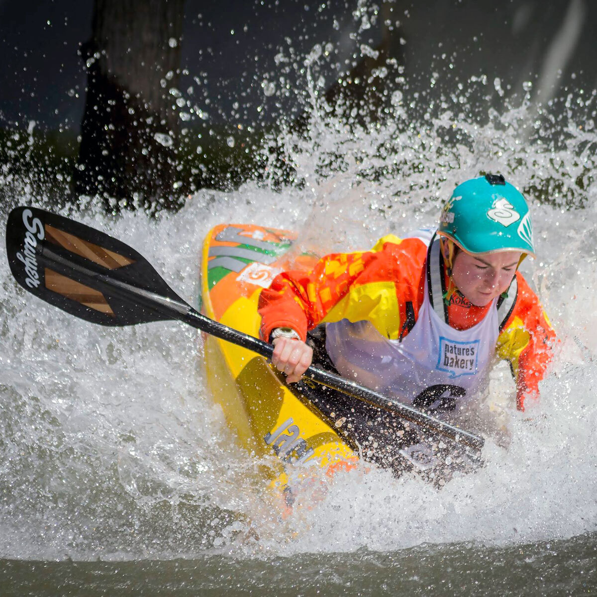 Courtney Kerin freestyle kayaking on whitewater