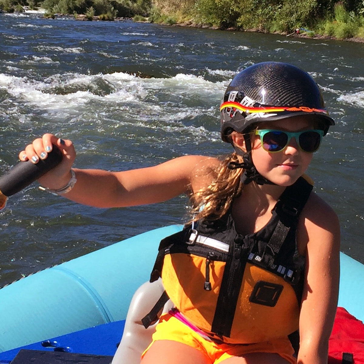 Ellie Clapp rafting at a young age