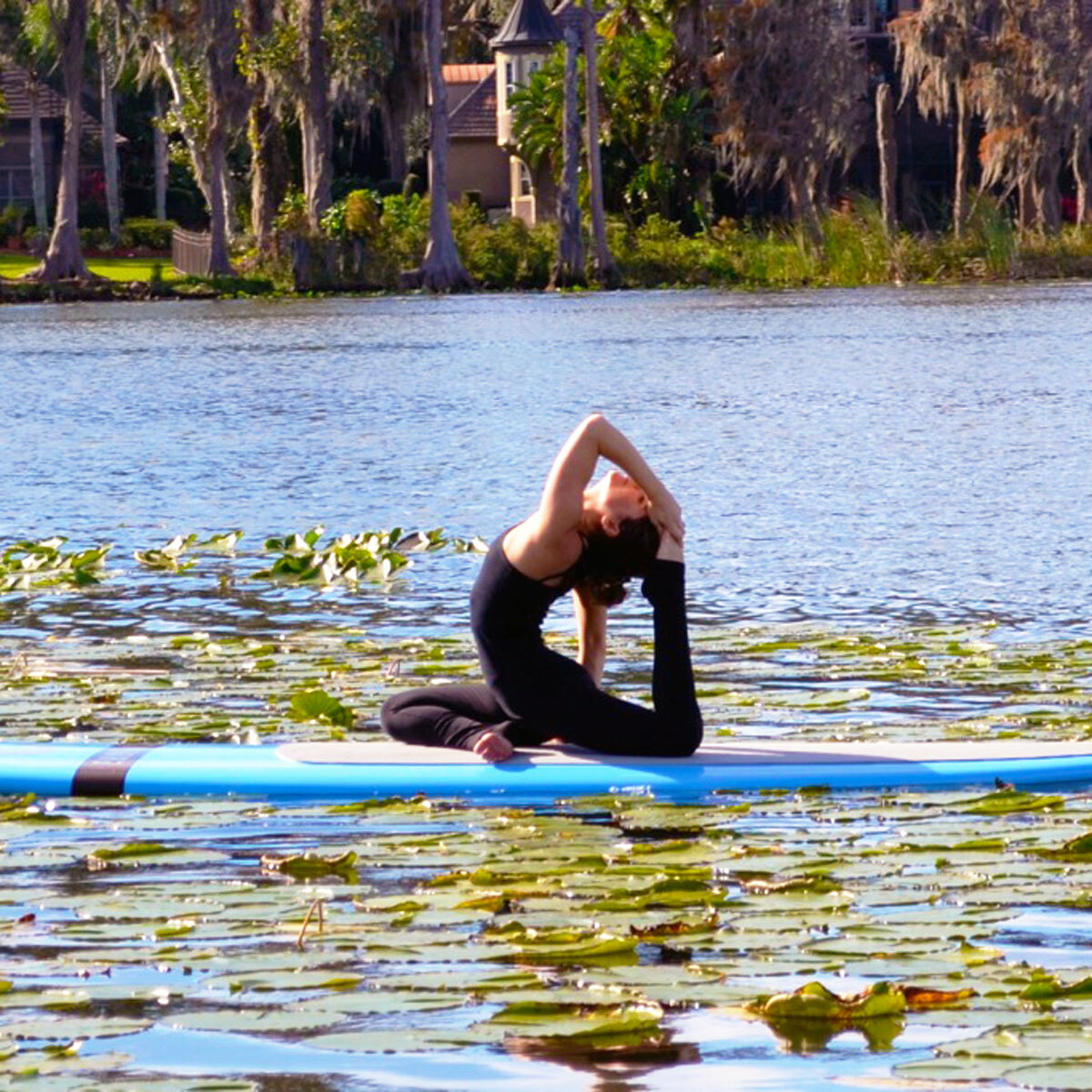 Jessica Amendola practicing SUP yoga on the lake