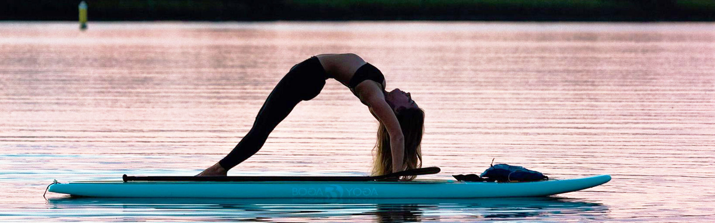Jessica Amendola teaching SUP yoga on the water