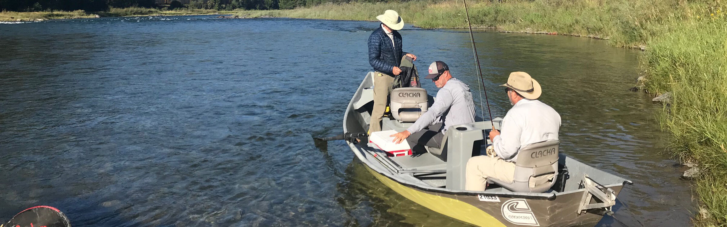 Tim Linehan rowing a drift boat in Montana
