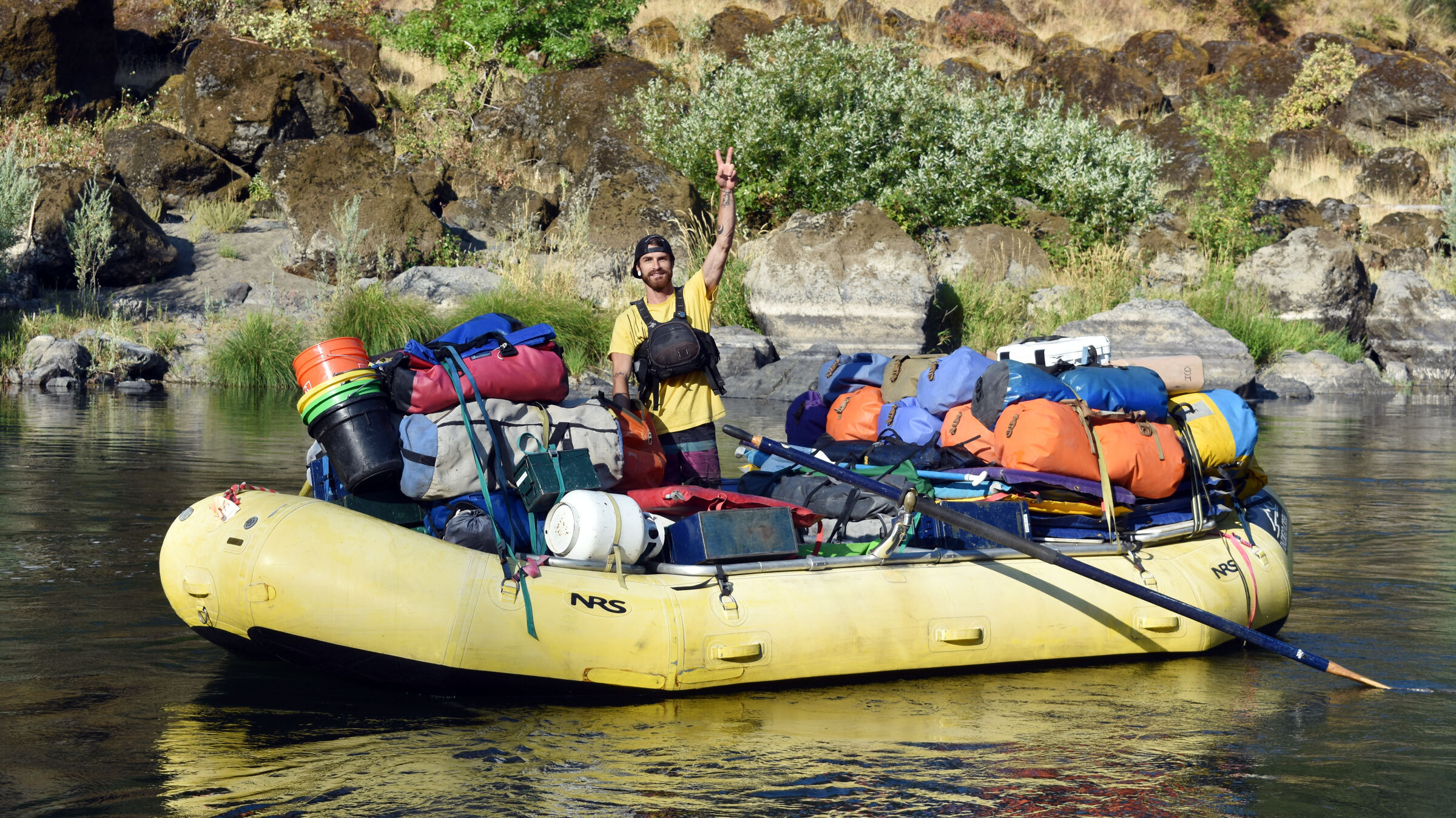 Ian Gannon Artist Ian Gannon piloting a gear raft.