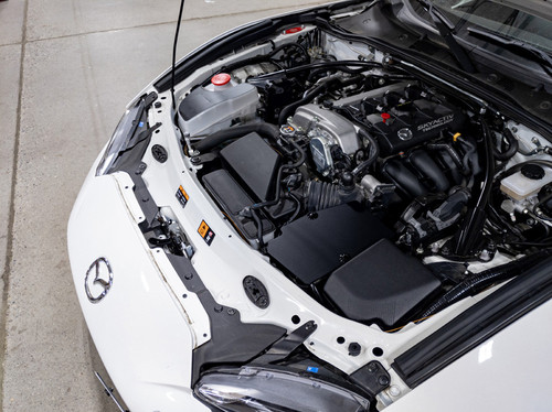 The CravenSpeed Battery Shield installed in a white 2016 Mazda MX-5 Miata ND.