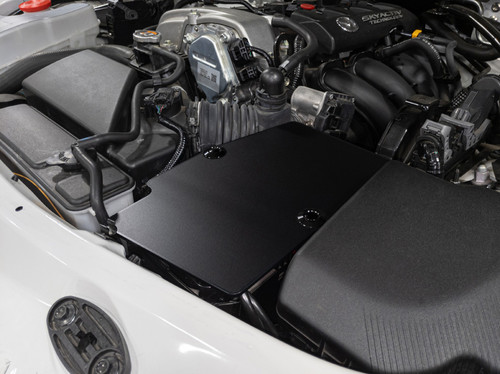 The CravenSpeed Battery Shield installed in a white 2016 Mazda MX-5 Miata ND.