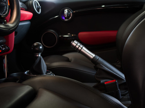 The stainless steel version of the CravenSpeed Hand Brake Handle installed in a 2016 MINI Cooper S.