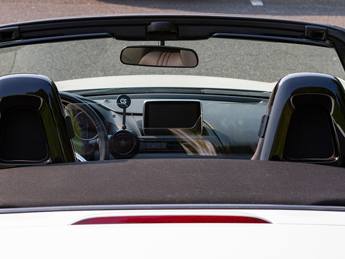 The MX-5 Things Acrylic Wind Deflector installed in a Mazda MX-5 Miata ND directly behind to show visiblity