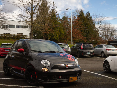 A Fiat 500 Abarth with the CravenSpeed roof trim protector installed, black brat