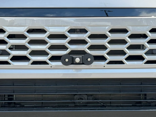 NOTE: Installation on the lower grille (black grille area) is not recommended due to stability issues. 