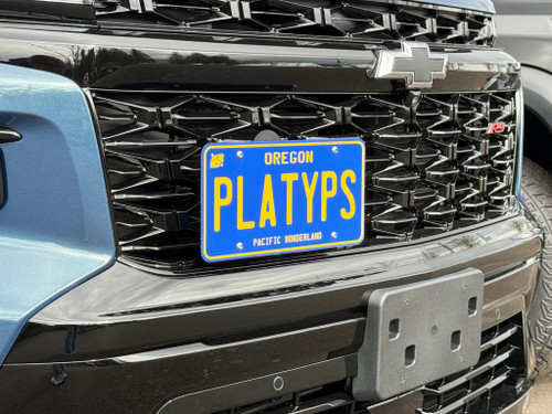 The Platypus License Plate Mount shown on a 2026 Chevy Traverse RS. 
