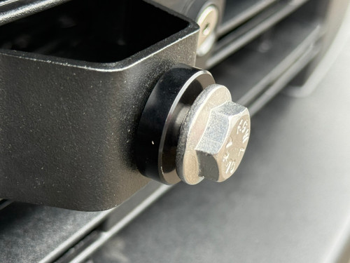 Installed the included .25in spacer as shown. The spacer will keep the plate frame from making contact with the bumper. 