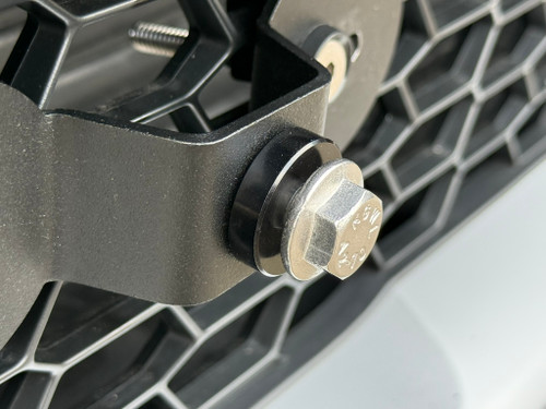 Install the .25in spacer as shown. The spacer will provide a bit of extra clearance for the license plate frame, and keep it from making contact with the bumper