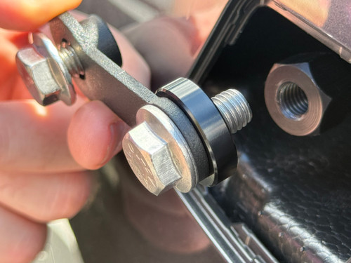 Install the .25in aluminum spacer as shown on to the extension arm. The spacer will provide a bit of extra clearance for the extension arm and allow the plate frame to not make contact with the bumper. 