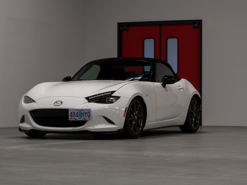 The CravenSpeed Platypus License Plate Mount installed on a white 2016 Mazda MX-5/Miata ND.