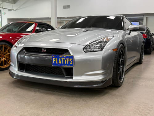 The Platypus License Plate Mount shown on a pre-facelift 2009 Nissan GT-R. NOTE: This kit will not work with facelift (2017-2024) GT-Rs.
