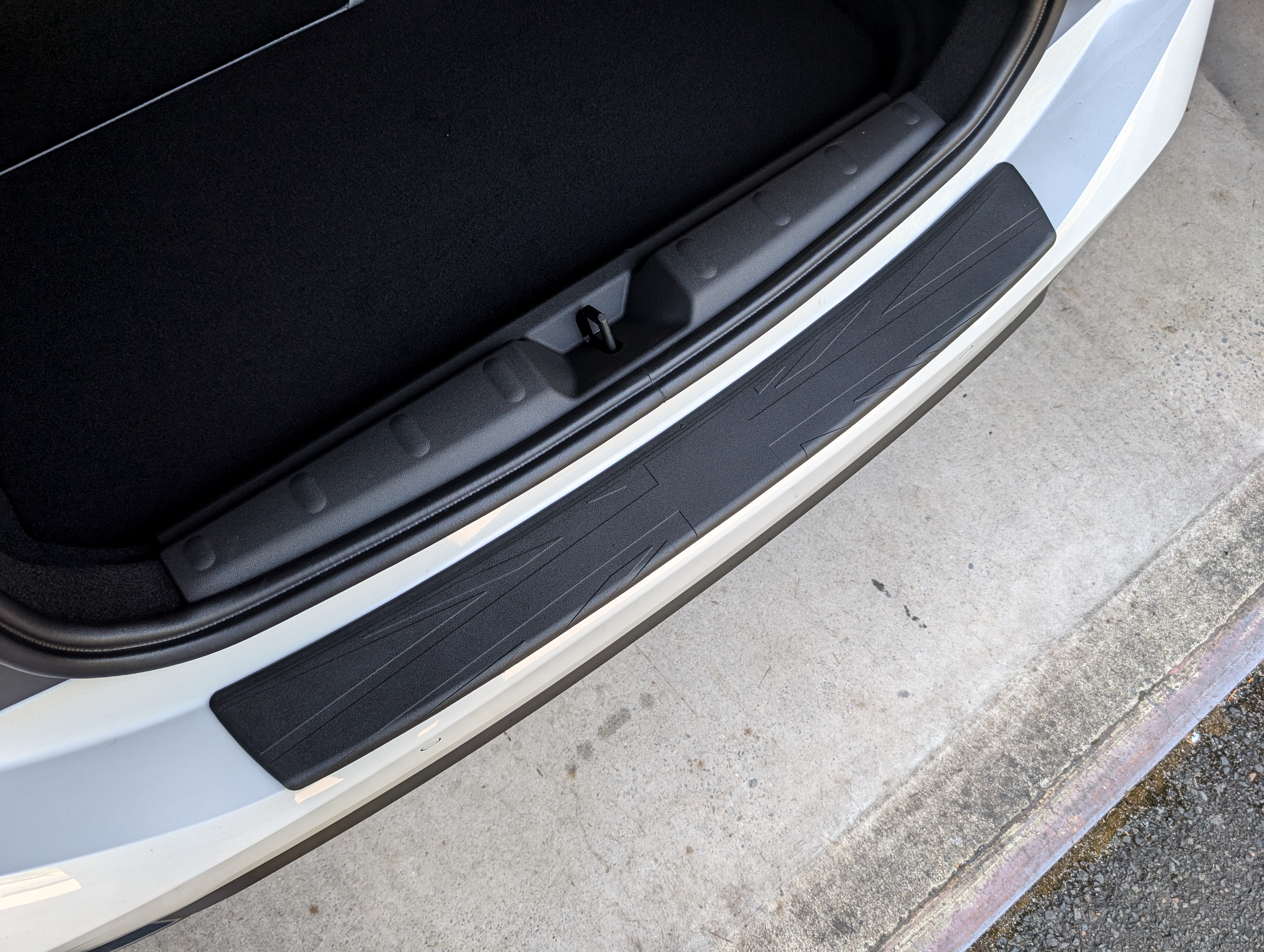 Dawn Enterprises Rear Bumper guard custom-fitted to a 2025+ F66 MINI Cooper, showing the precision-contoured paint protection.