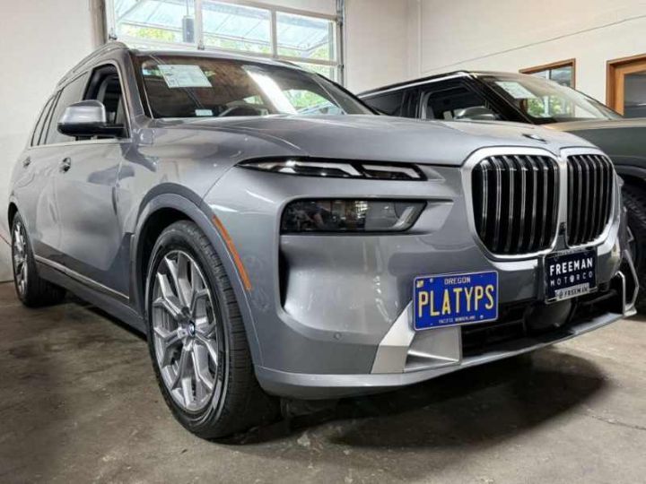 The Platypus no-drill license plate mount installed on a BMW X7 xDrive40i front bumper