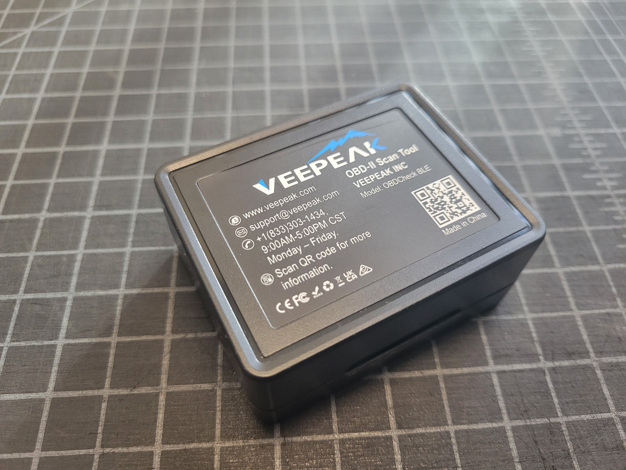 VeePeak Bluetooth OBDII Diagnostic Tool with the included case with manufacturer info