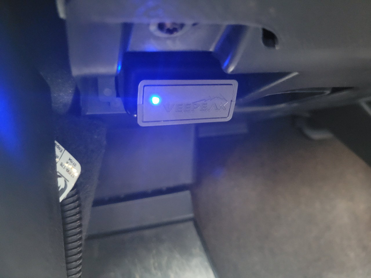 VeePeak Bluetooth OBDII Diagnostic Tool plugged into a 2014 BMW X5