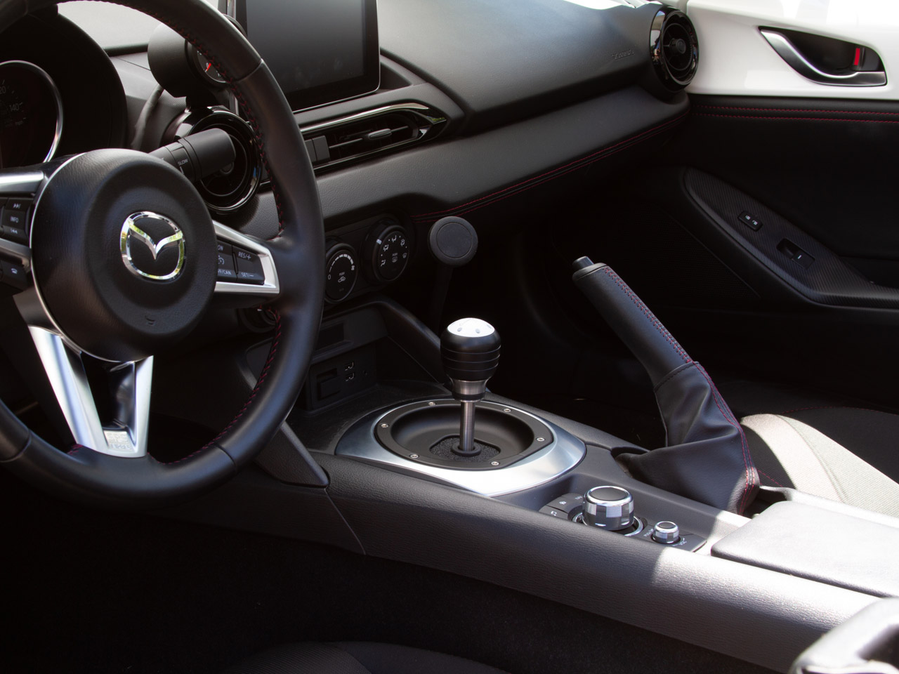 The Gemini Flex Phone mount with Magnet attachment installed in a 2016 Mazda Miata.