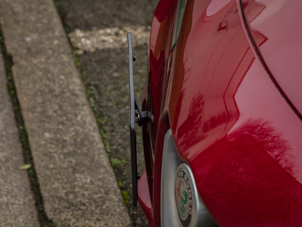 The CravenSpeed Platypus License Plate Mount installed on a 2018 Alfa Romeo Giulia Quadrifoglio.