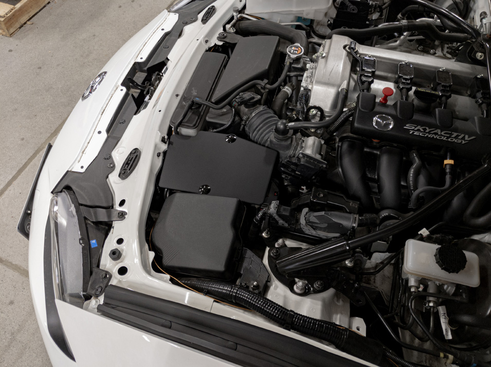 Battery Shield, installed on MX-5 Miata, cleans up the engine bay