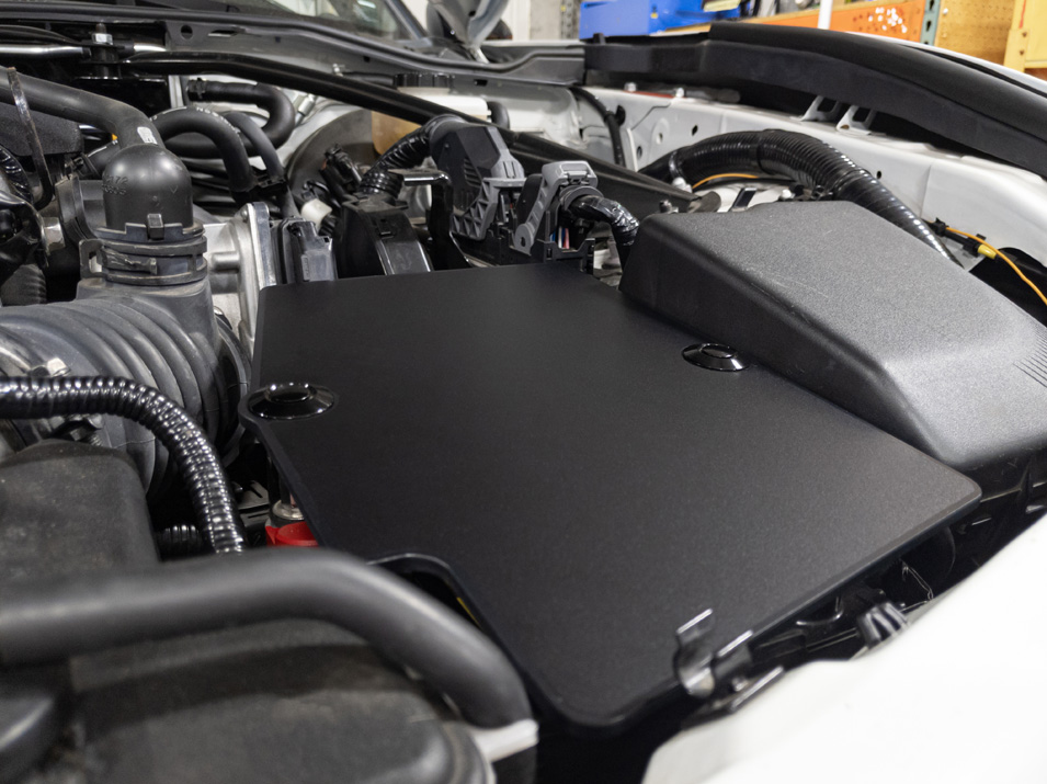 The CravenSpeed Battery Shield installed in a white 2016 Mazda MX-5 Miata ND.