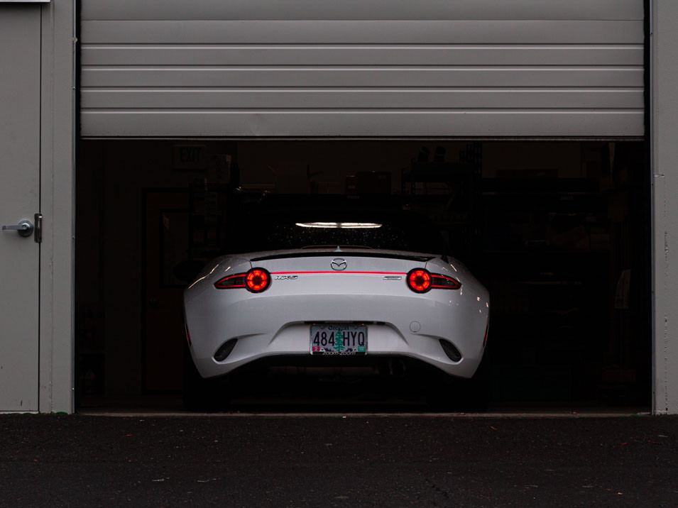 The MX5Things rear led running light installed on a white 2016 ND Miata