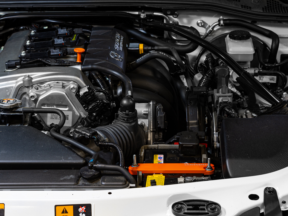The CravenSpeed Battery Tie Down for Mazda MX-5 Miata RF 4th gen ND 2017 to 2023 Orange