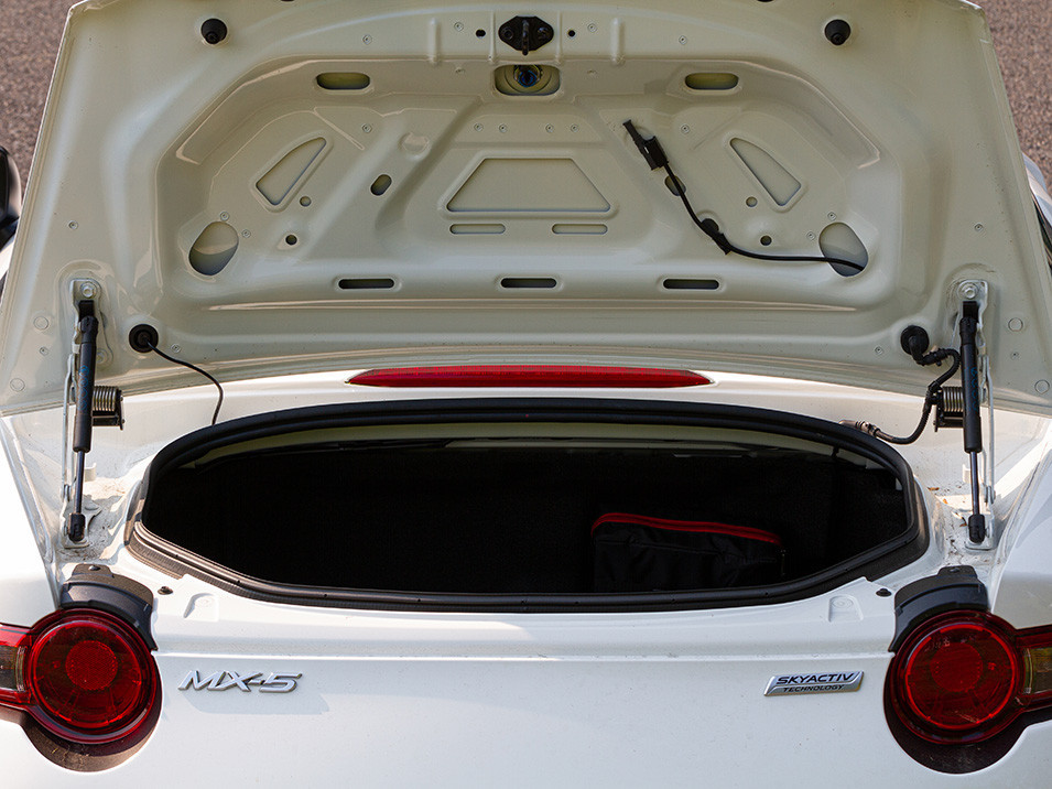The opened trunk of the ND MX-5 with both trunk popper mechanisms installed.