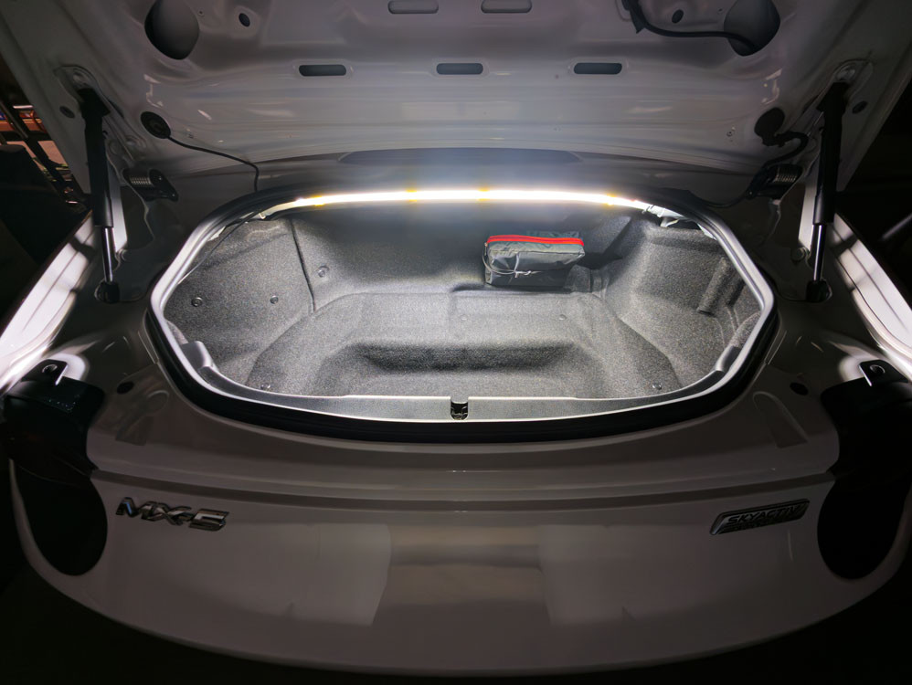 Demonstration of the open trunk lit up with the bright led strip visible.
