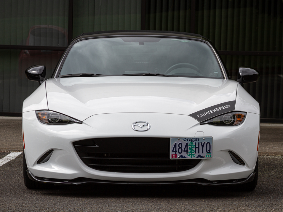 The CravenSpeed Graphics Kit and CravenSpeed Platypus License Plate Mount installed on a white 2016 ND Miata.