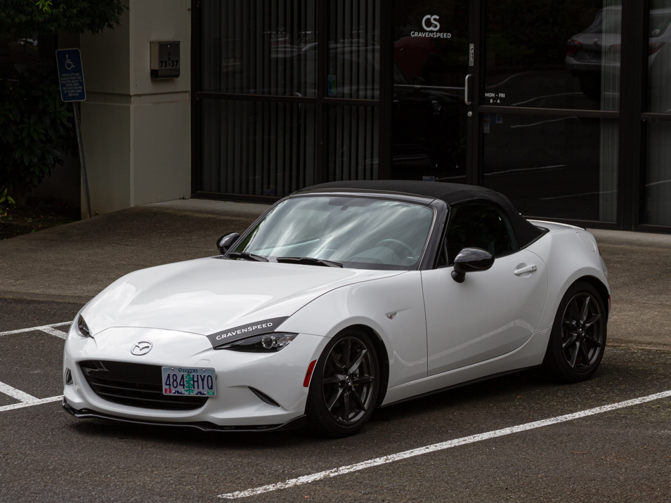 The CravenSpeed Graphics Kit and CravenSpeed Platypus License Plate Mount installed on a white 2016 ND Miata.