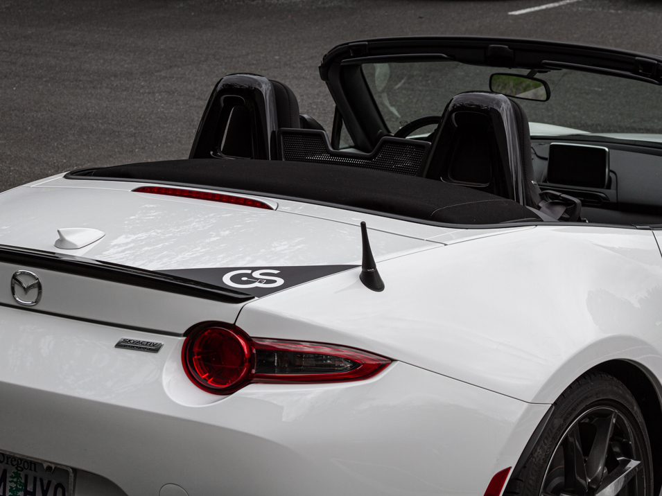 The CravenSpeed Graphics Kit and CravenSpeed Stubby Antenna installed on a white 2016 ND Miata.