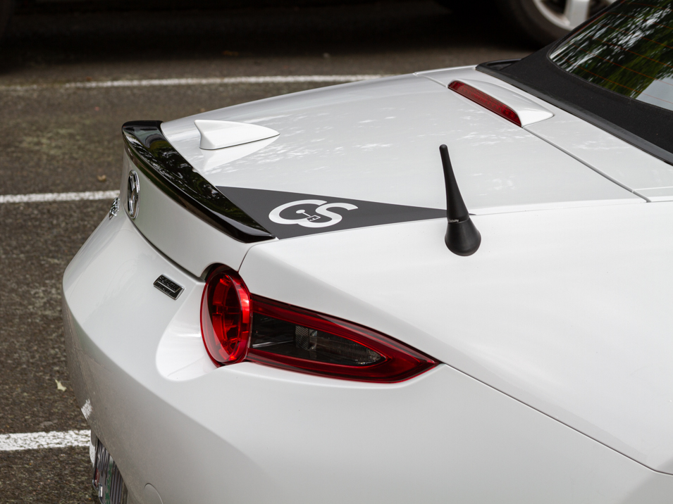 The CravenSpeed Graphics Kit and CravenSpeed Stubby Antenna installed on a white 2016 ND Miata.