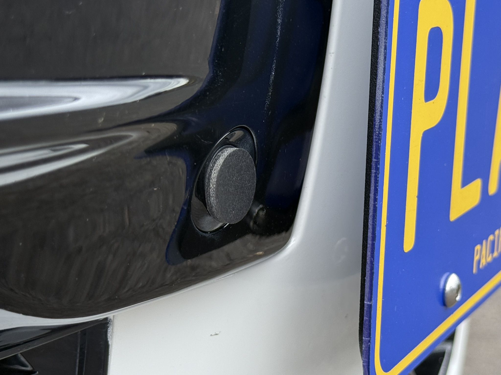 Place 2 blinders (included) over the parking sensor. 