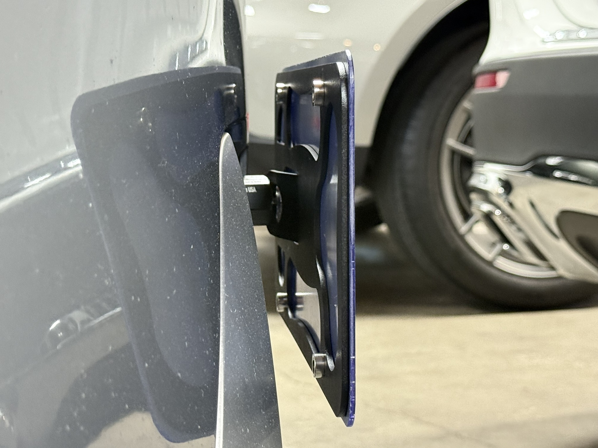 The Platypus License Plate Mount shown on a 2025 BMW X7 xDrive40i