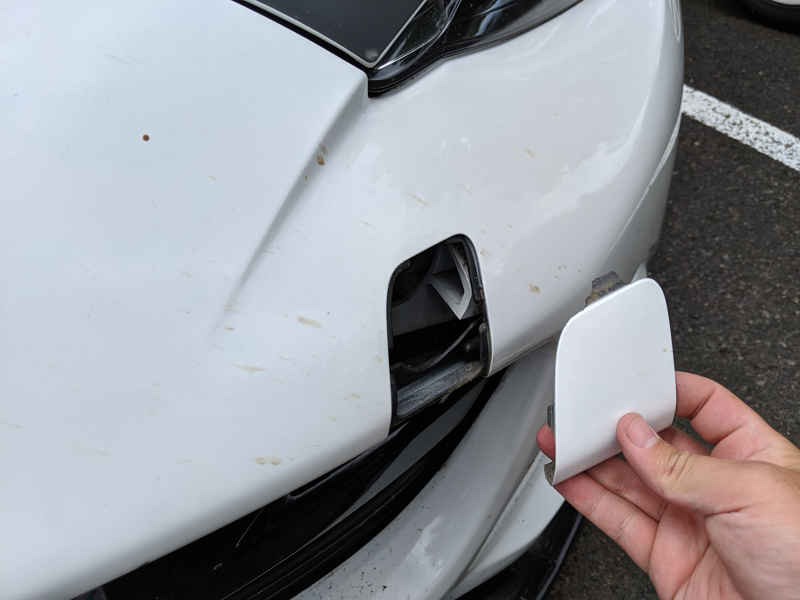 removing the towing eye cover