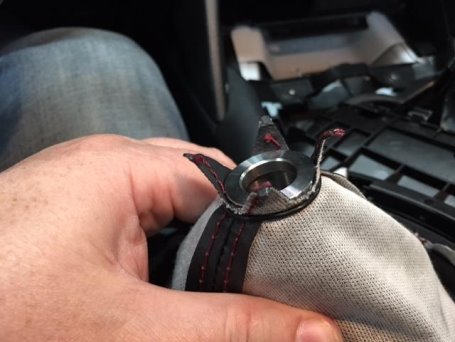 the bottom of the stainless steel core pushed into the opening in the shift boot with the o-ring securing the boot