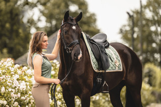 A woman modeling a riding helmet