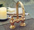 Strom Plumbing P0629S - Columbia 4 inch Center Bridge Faucet with Gooseneck Spout and Porcelain Lever Handles, Supercoat Brass