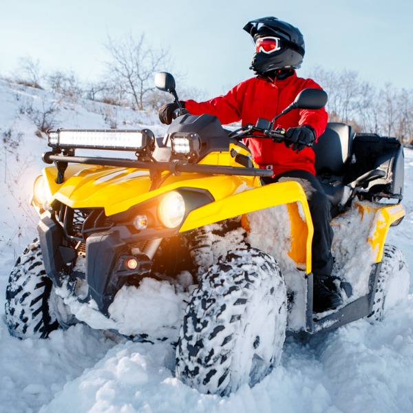 ATV traveling through snow