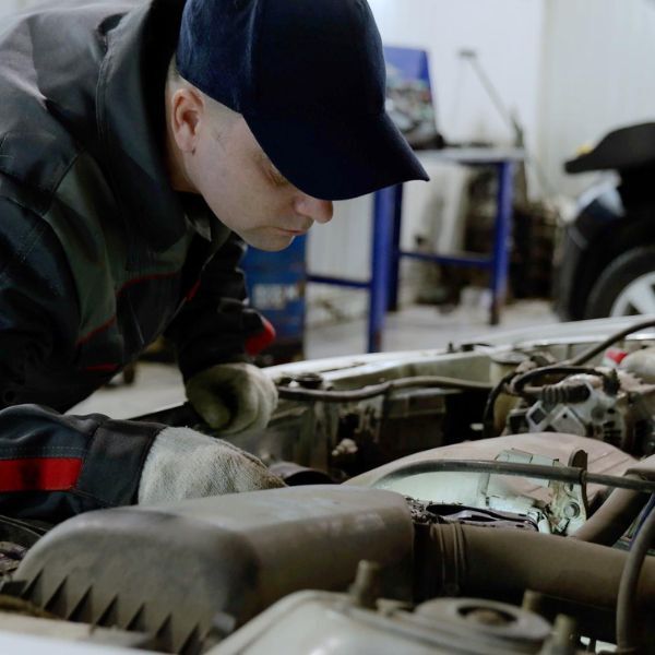 Mechanic inspecting engine